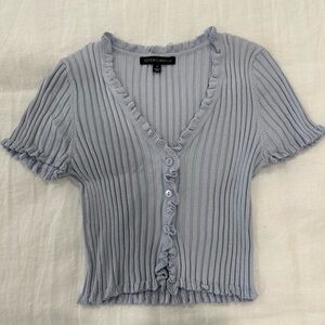 Isabelle’s Cabinet blue knit top